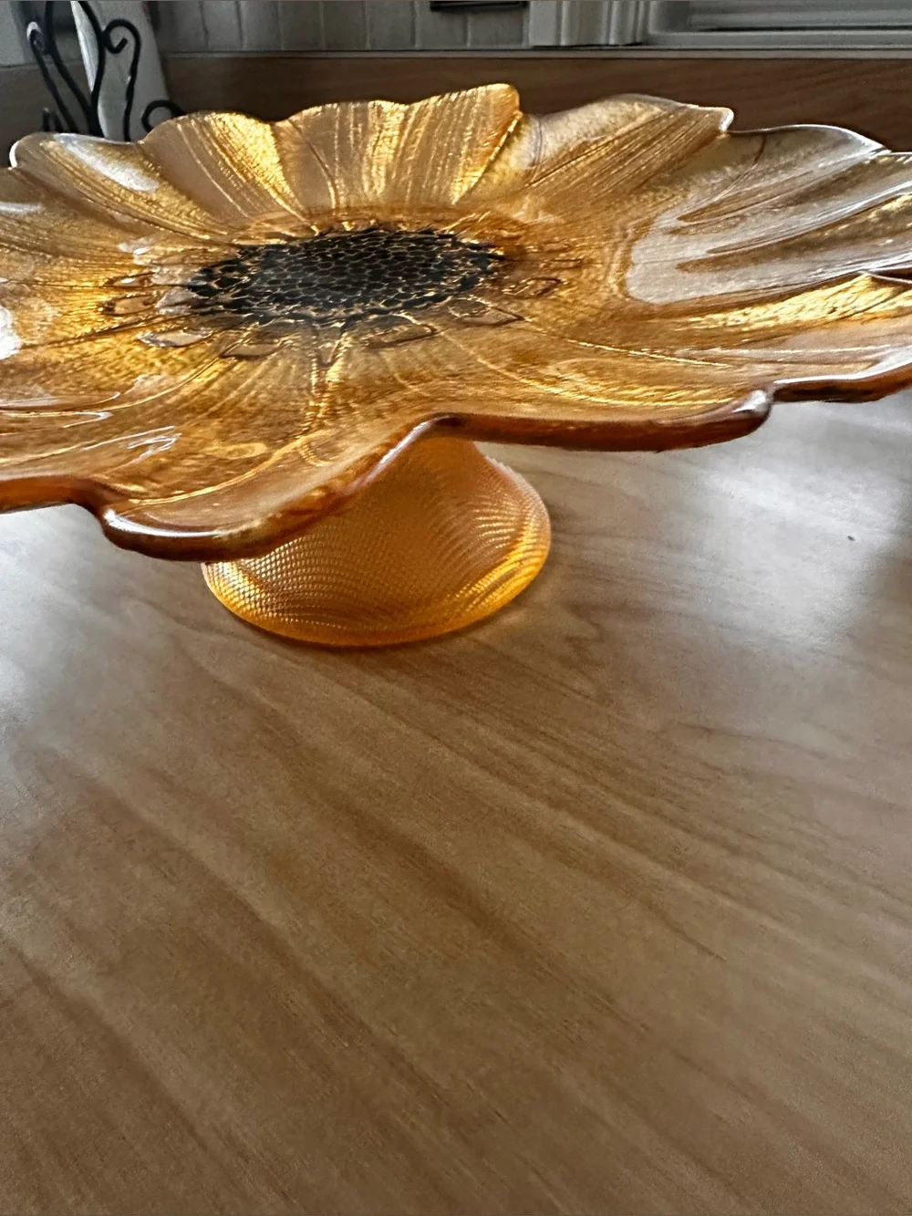 Gold sunflower glass decorative plate on a pedestal stand